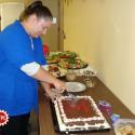 Local President Stephanie Primrose cuts the cake at certification celebration.