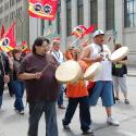 Traditional Aboriginal drummers lead the march