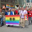 PSAC members hold the GLBT Pride flag while marching
