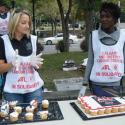 Volunteers distributing PSAC's "We Are All Affected" cupcakes at the BBQ.