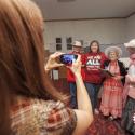 PSAC Prairies REVP Marianne Hladun taking a photo with the Raging Grannies.