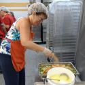 Karen Zoller buttering up the vegetables